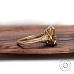 Side profile view of chunky elongated cushion ring in yellow gold.