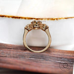 Classic trilogy moissanite ring with high polish finish