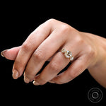 Hand worn three stone moissanite ring front perspective
