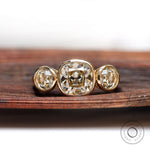 Three stone cushion moissanite ring in 10K yellow gold front view