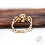 Back view of yellow gold three stone engagement ring