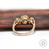 Back view of yellow gold three stone engagement ring