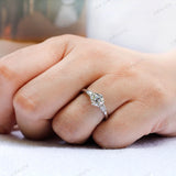 Art deco style three stone engagement ring with round center 