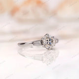 Round 1 carat old European cut center stone with tapered baguette accents 