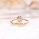 View of the back of the solitaire engagement ring with round moissanite center stone in 10K yellow gold.