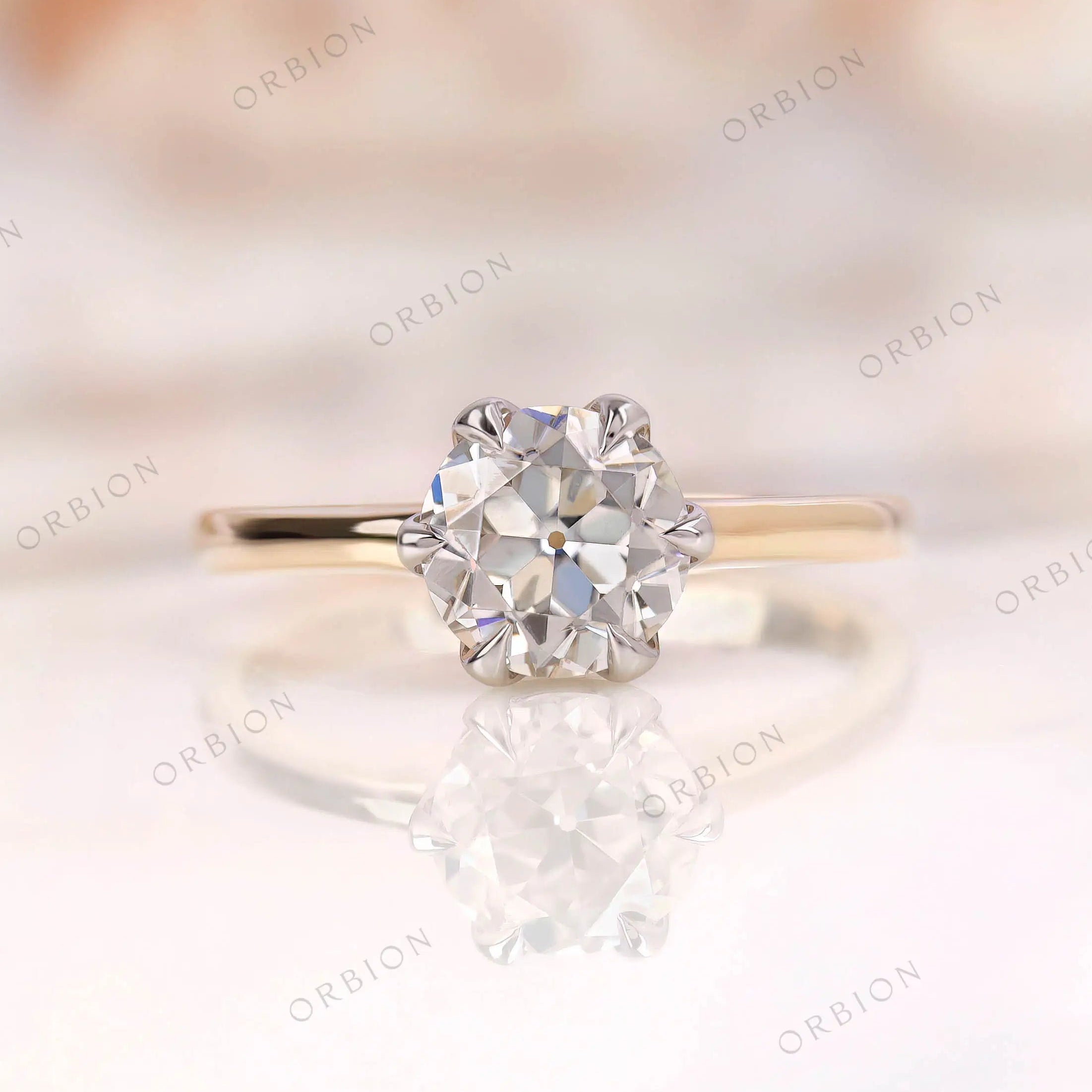 Old European Cut Moissanite ring, round shape, set in a dual-tone 10K yellow-white gold band