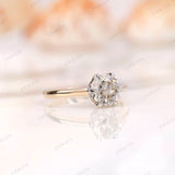 Side angle view of the Old European Cut Moissanite solitaire ring, focusing on the bezel setting and band in dual-tone 10K gold.