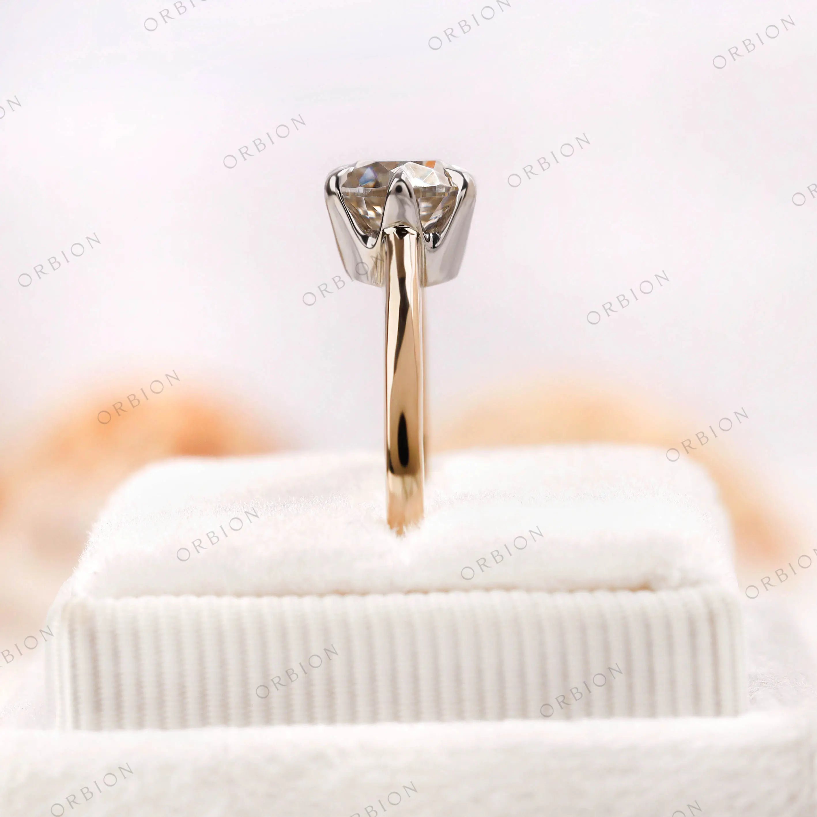 Top-down view of the Old European Cut Moissanite solitaire engagement ring, highlighting the stone and dual-tone gold setting in fine detail.