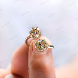 Close up of prong setting on toi et moi champagne moissanite ring