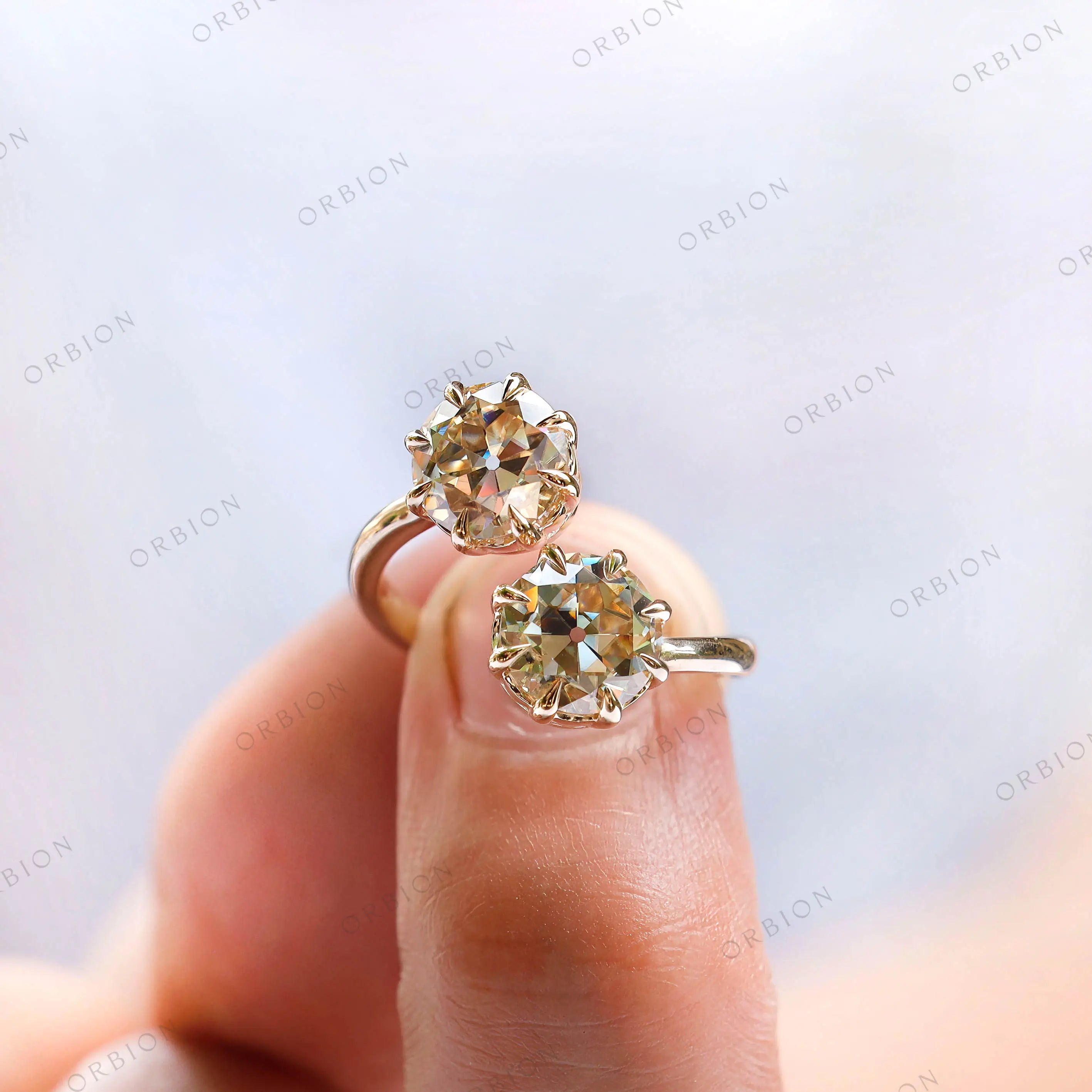 Close up of prong setting on toi et moi champagne moissanite ring