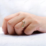 Open style engagement ring with round moissanite stones