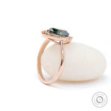 14k Rose Gold Marquise Blue Green Moissanite Engagement Ring Angle View