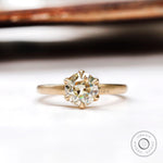 Round old European cut light champagne moissanite solitaire ring in yellow gold