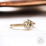 Front view of champagne moissanite solitaire ring in 10K yellow gold