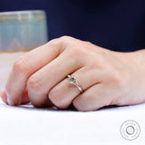 Minimalist solitaire engagement ring in yellow gold
