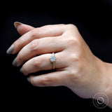 Hand shot of old European cut solitaire engagement ring