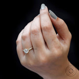 vintage solitaire engagement ring in yellow gold on finger