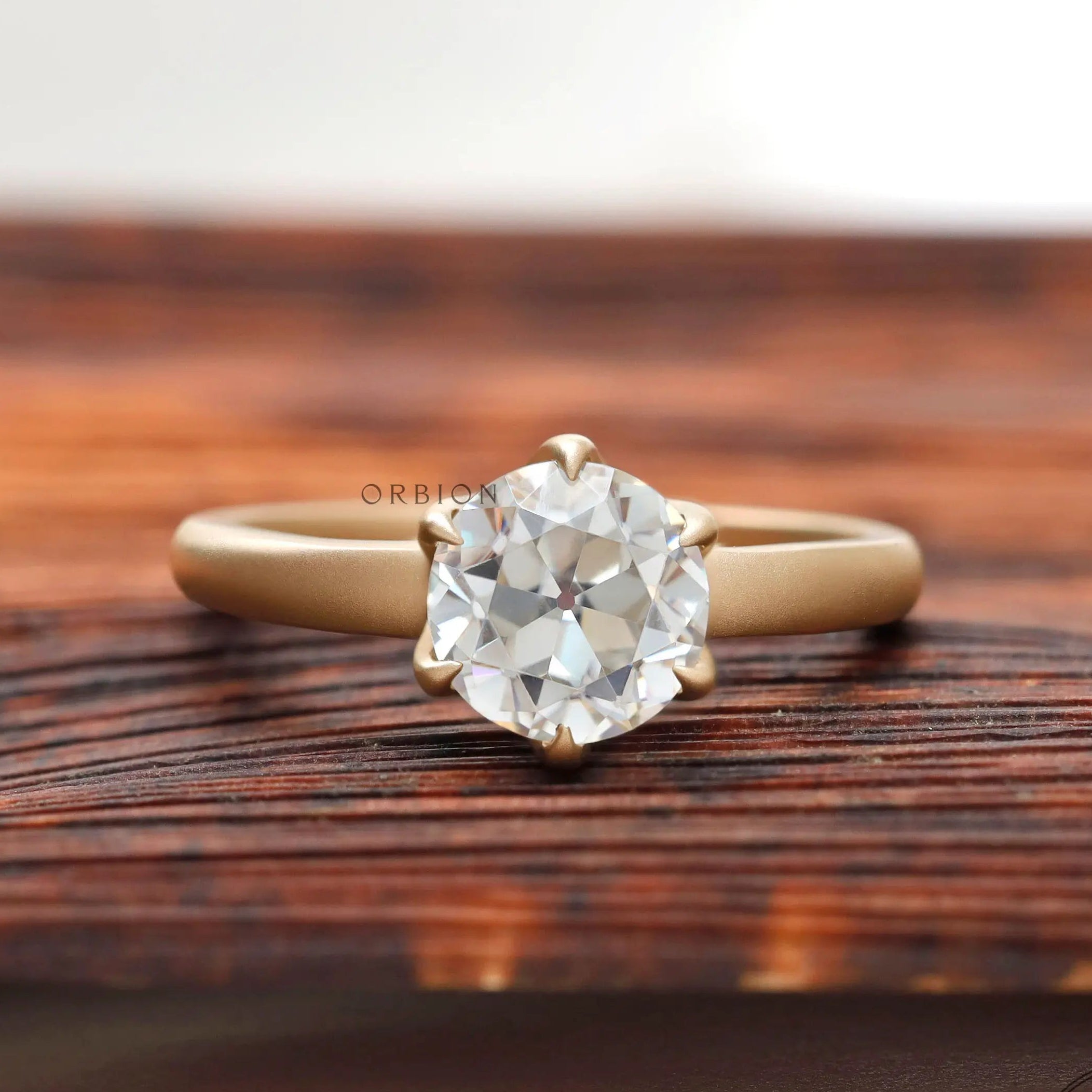 Old European cut solitaire engagement ring in matte yellow gold