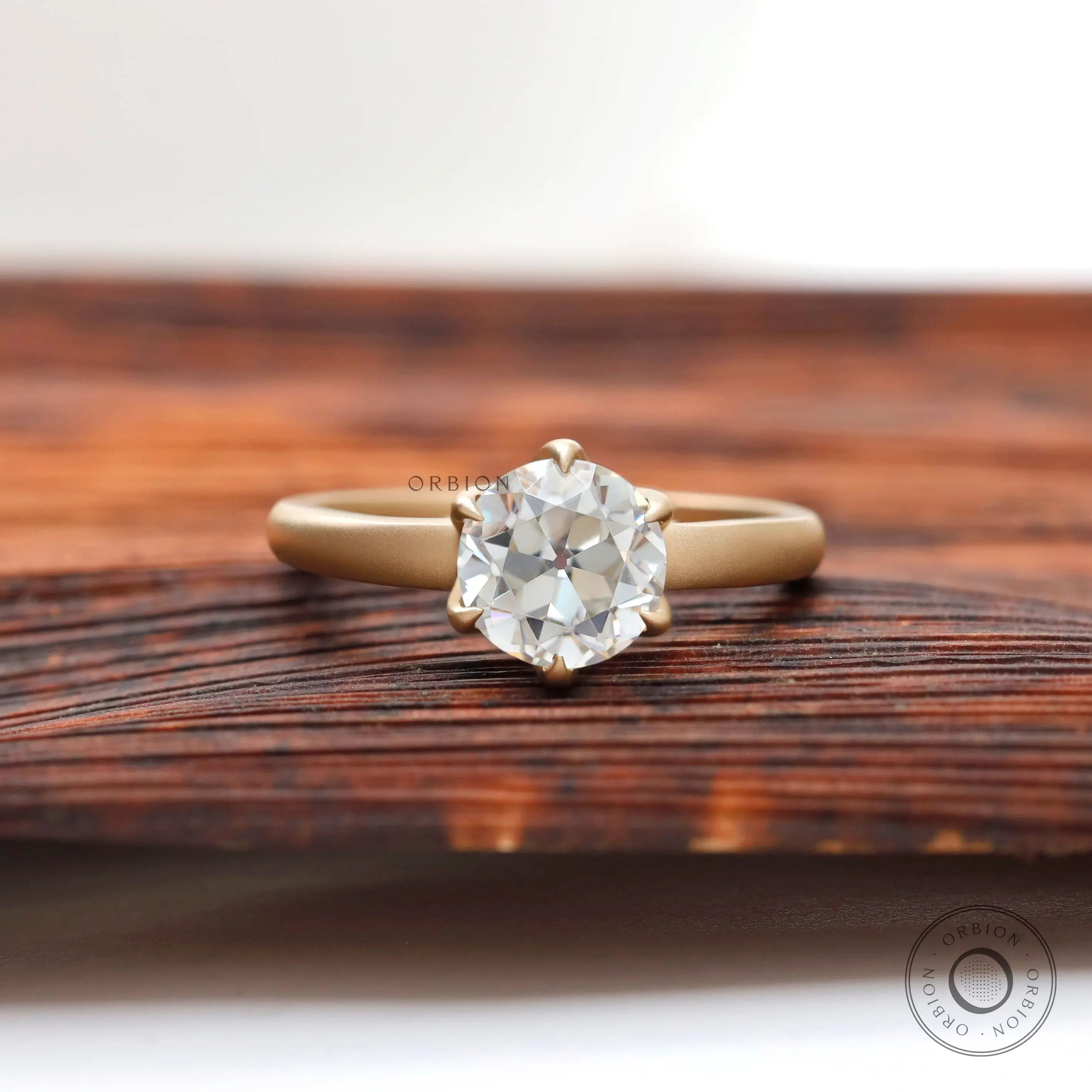 Old European cut solitaire engagement ring in matte yellow gold