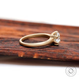 Minimalist vintage solitaire engagement ring in yellow gold