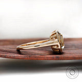 Side profile of elongated cushion moissanite bezel solitaire ring