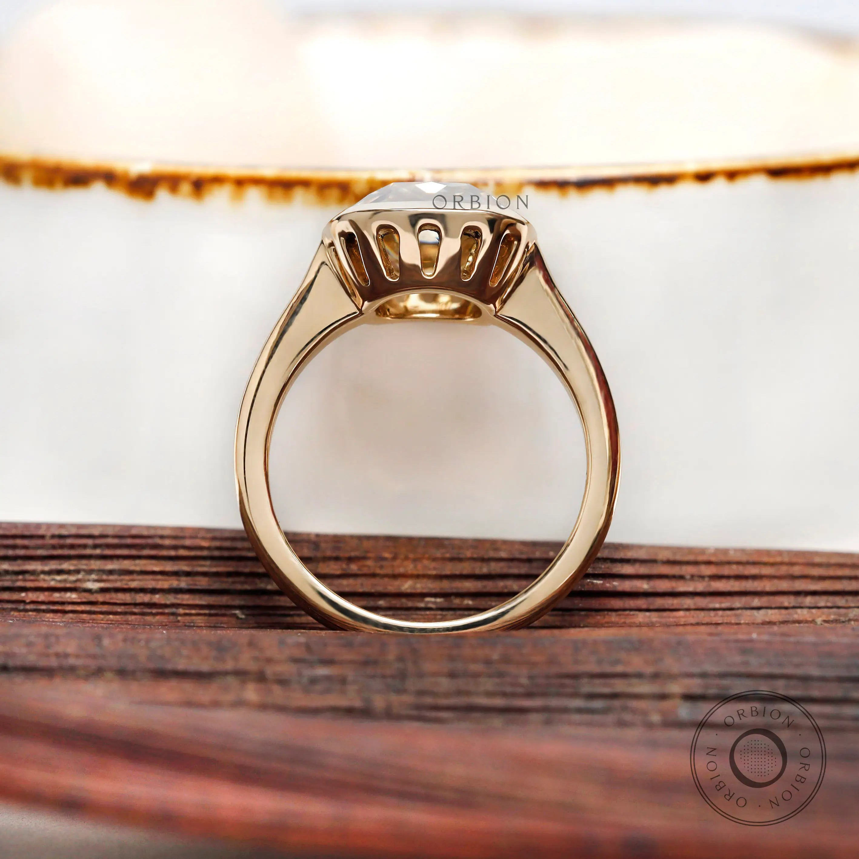 Close up of elongated cushion moissanite bezel frame detail