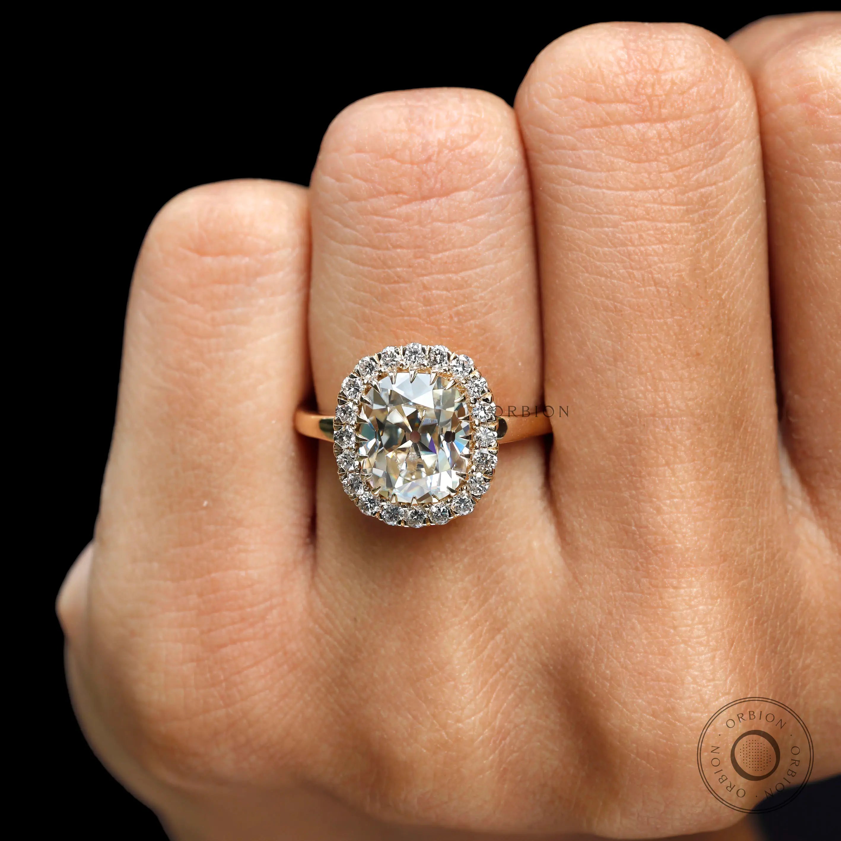 Vintage halo engagement ring with old mine cut cushion champagne stone
