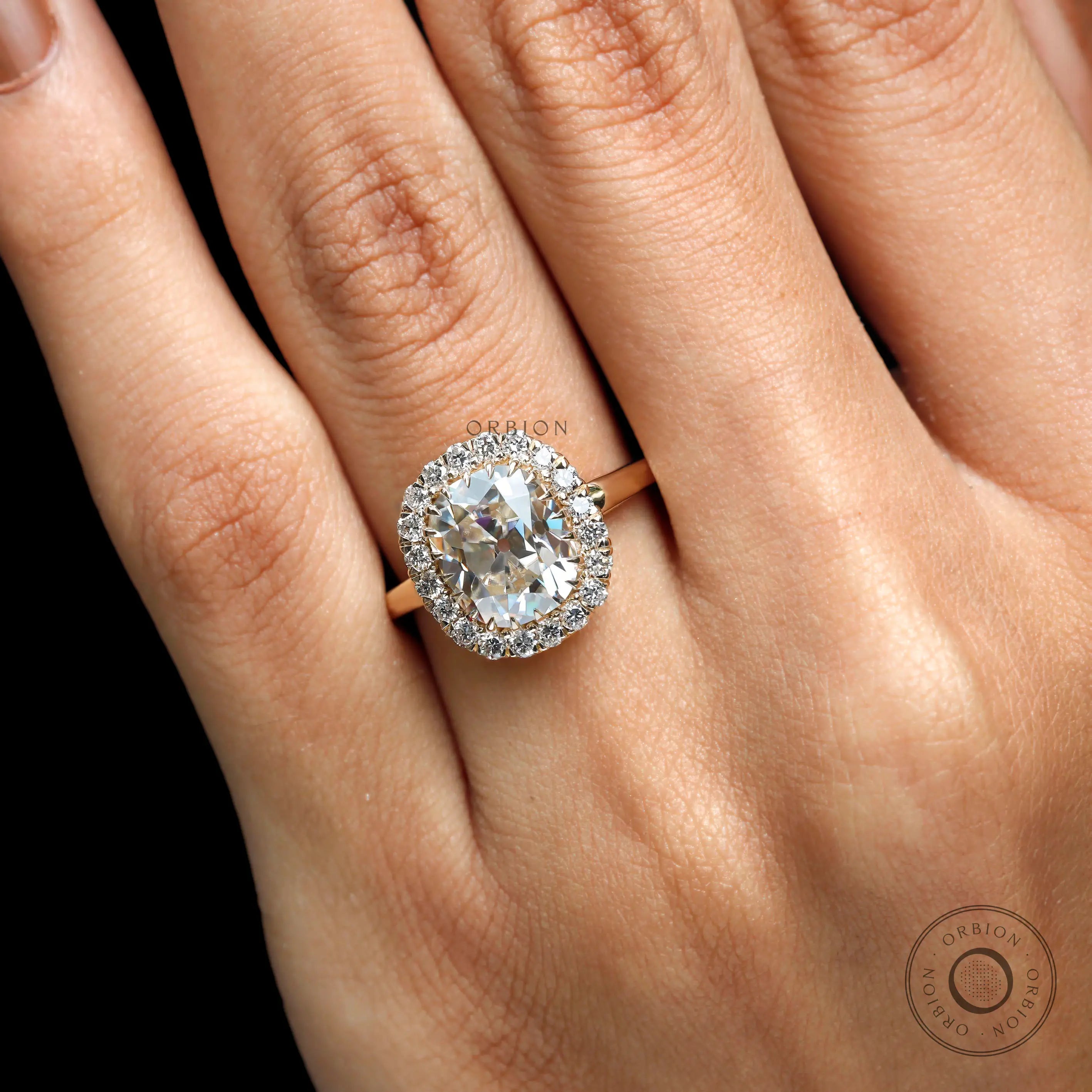 Cushion cut champagne stone halo ring close up