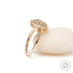 Slim band halo engagement ring yellow gold