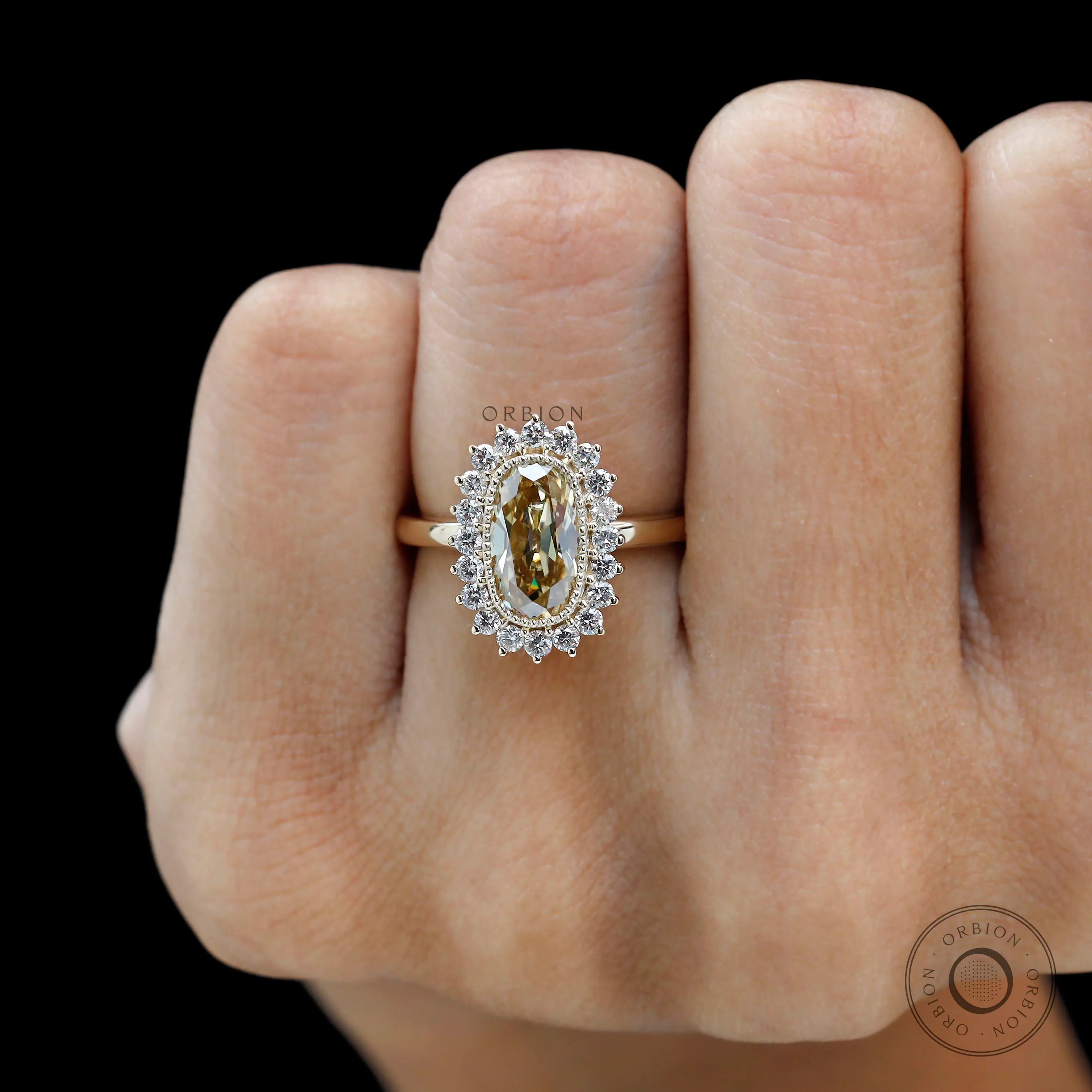 Old mine cut elongated cushion champagne moissanite ring close up