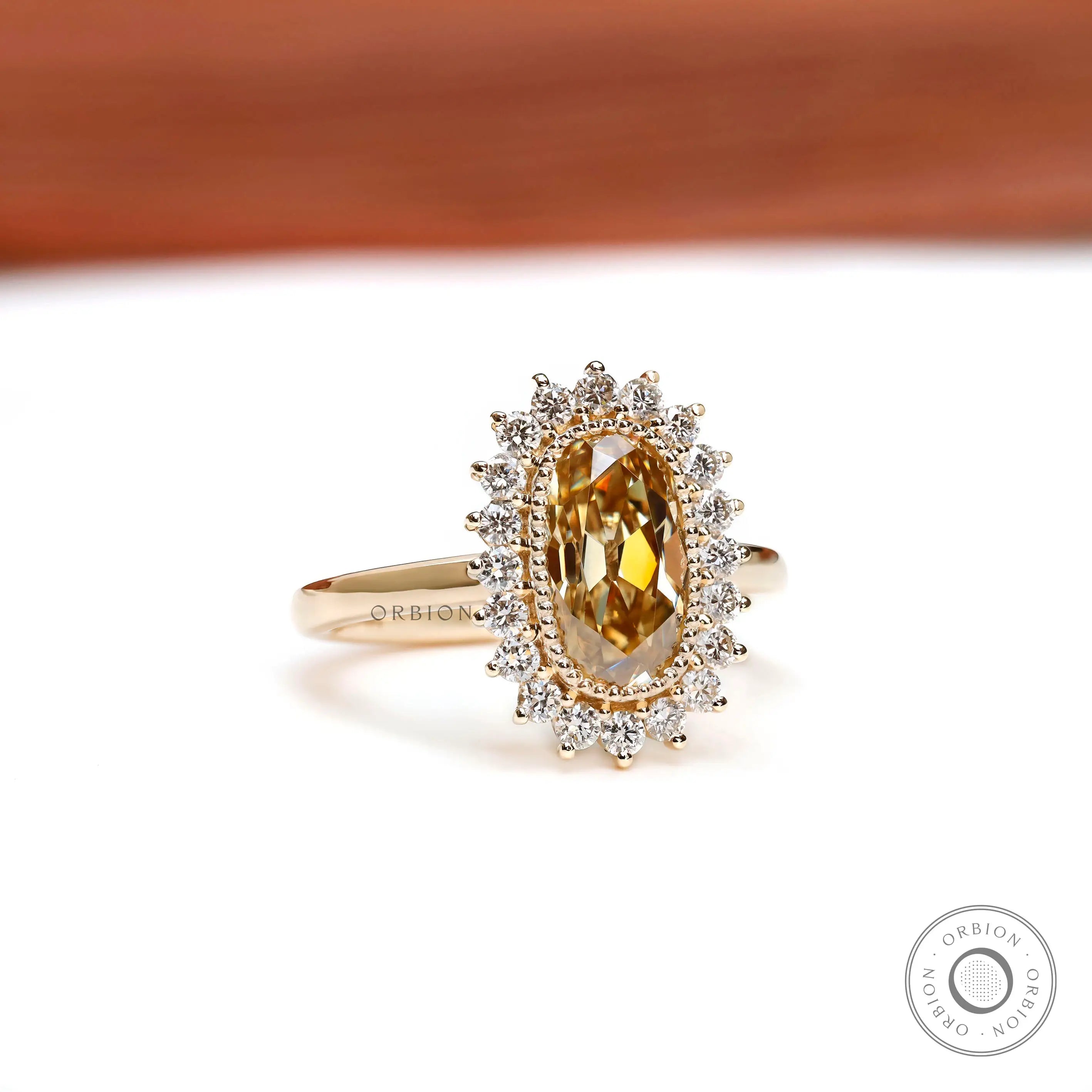 Elongated cushion Old Mine Cut champagne moissanite ring with milgrain halo