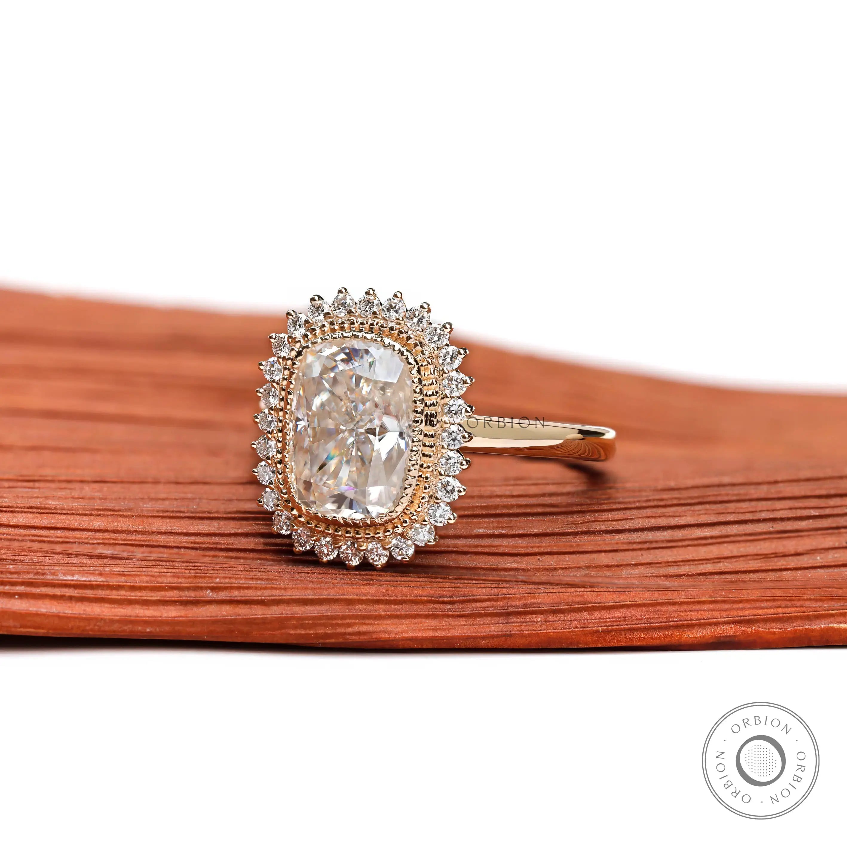 Side profile of elongated cushion halo engagement ring
