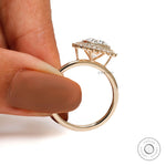 Classic halo moissanite engagement ring in yellow gold front view