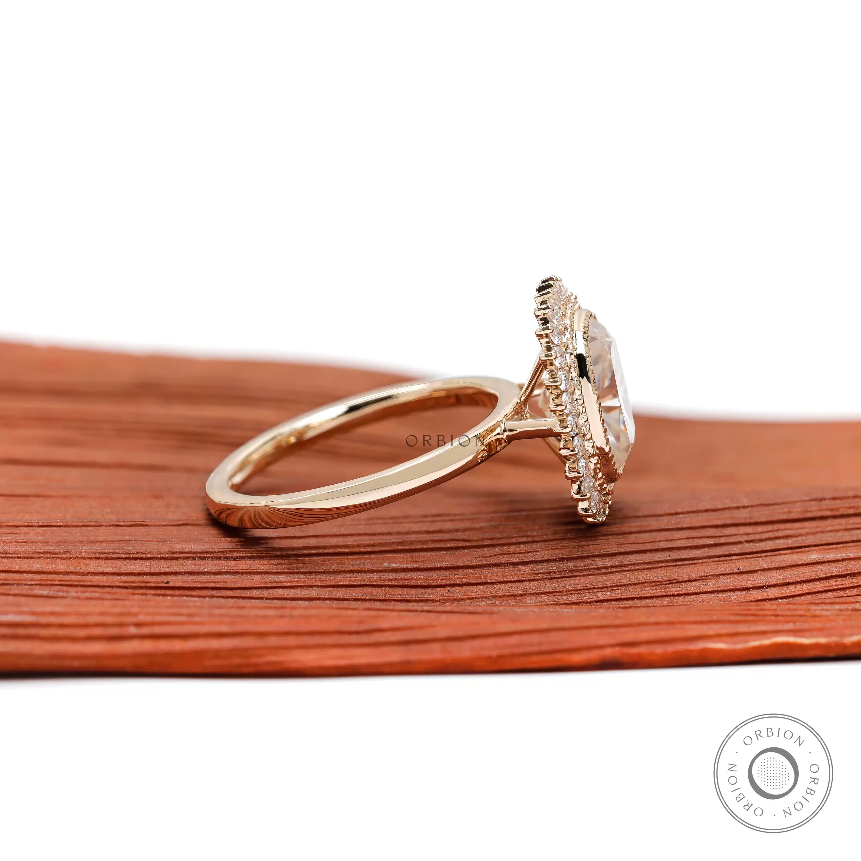 Halo engagement ring with slim yellow gold band