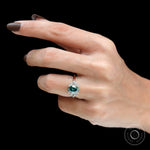 On-hand side view showing ring height and floral diamond arrangement