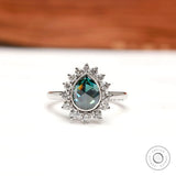 Pear rose cut blue green moissanite halo ring front view