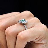 Pear rose cut moissanite ring on hand side angle