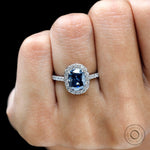 Deep blue moissanite engagement ring close up