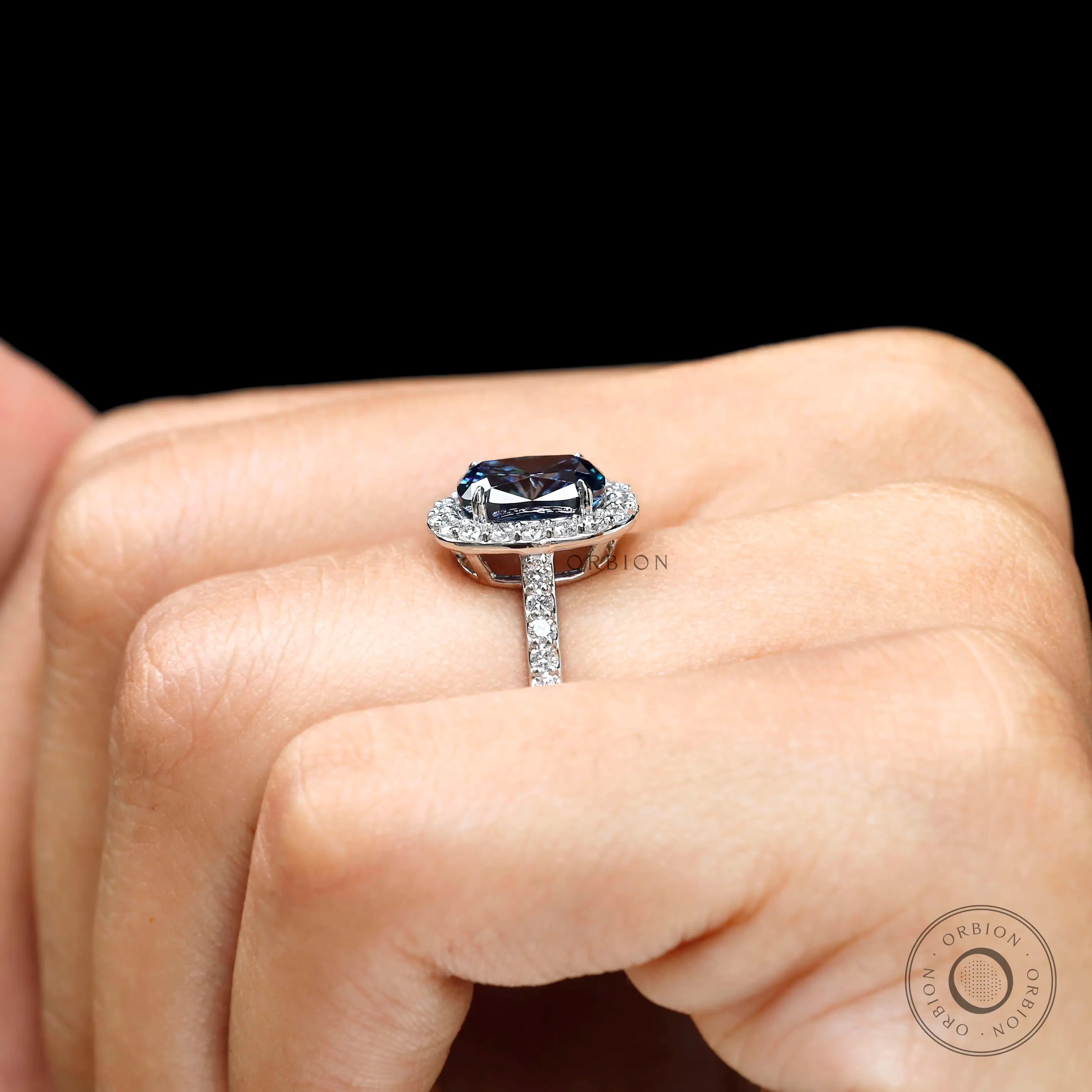 14K white gold halo engagement ring on hand