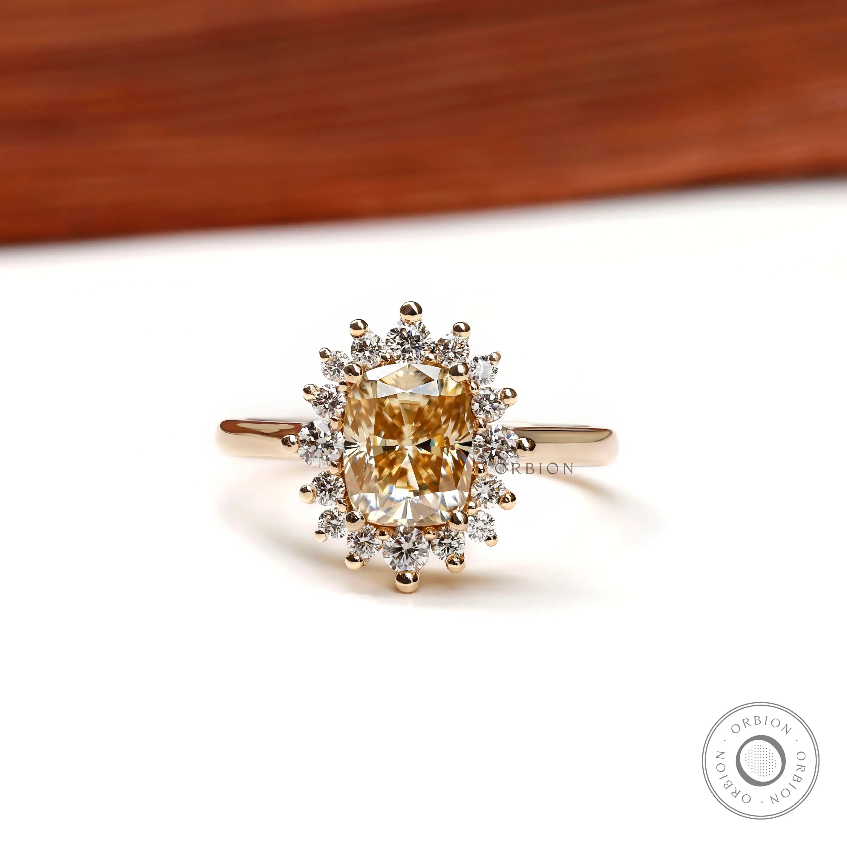 Elongated cushion yellowish champagne moissanite halo engagement ring front view
