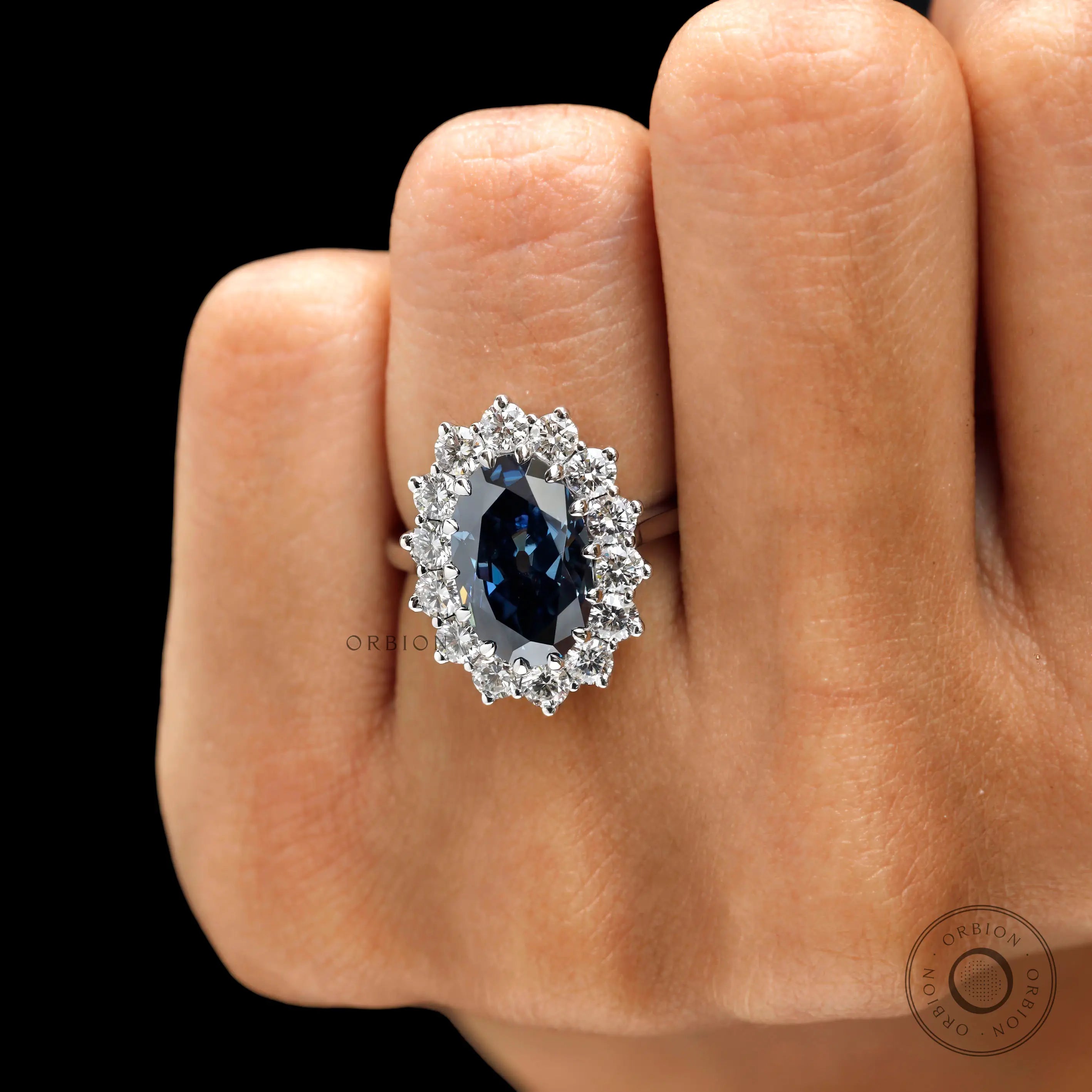 Oval blue moissanite halo ring multiple prong setting close up