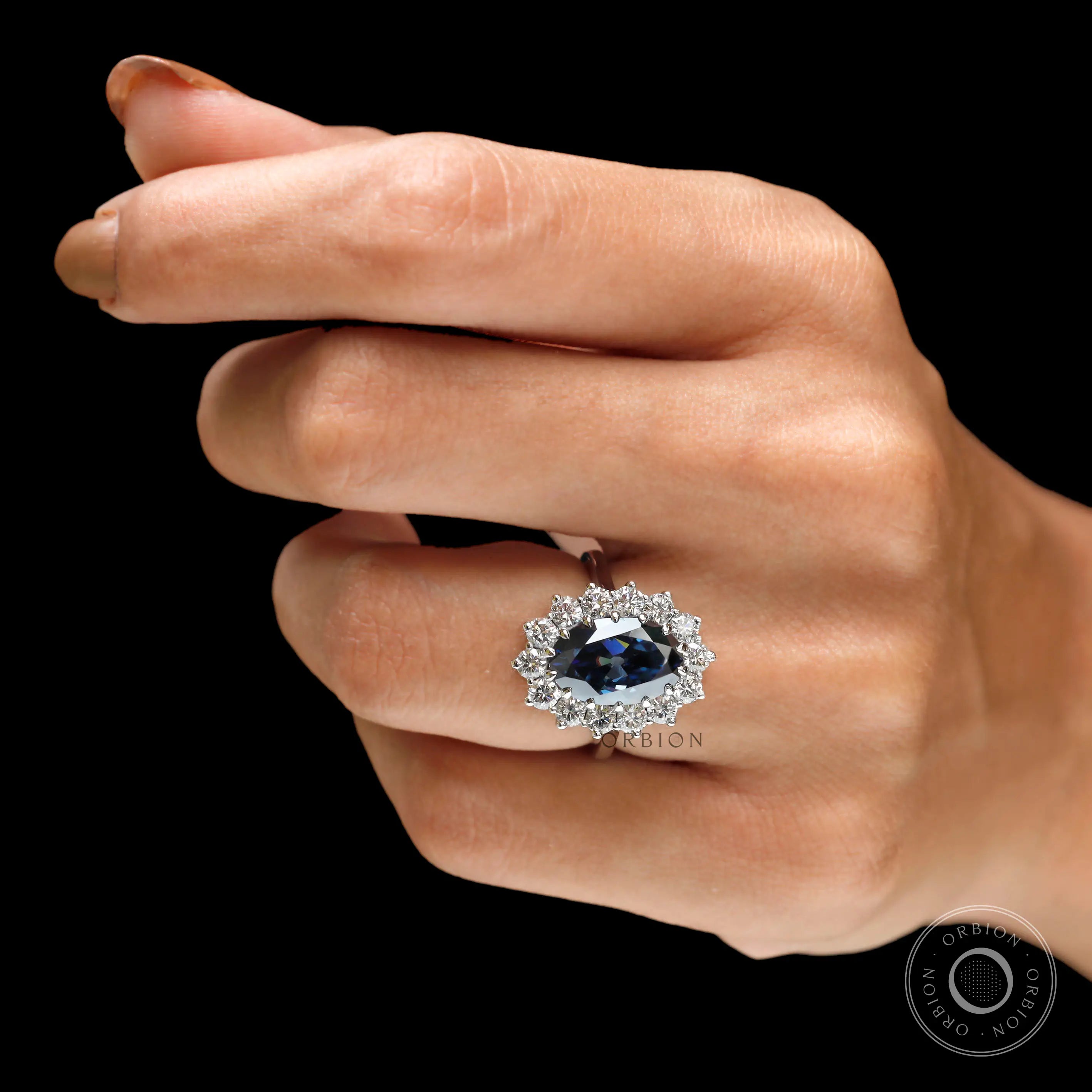 18k white gold oval blue moissanite halo wedding ring close up