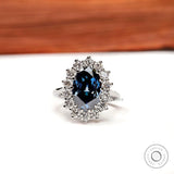 Oval deep blue moissanite halo engagement ring 18k white gold