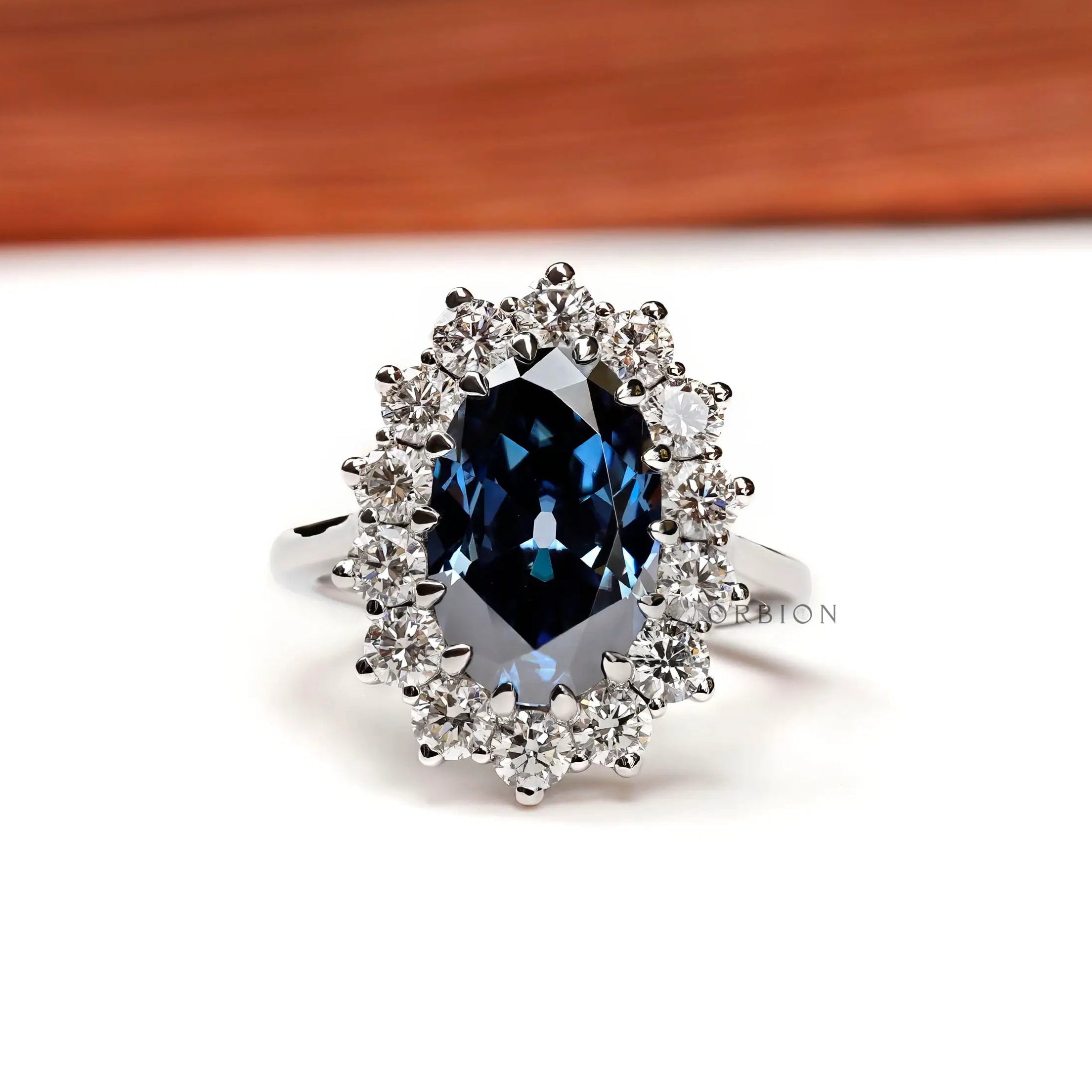 Oval deep blue moissanite halo engagement ring 18k white gold