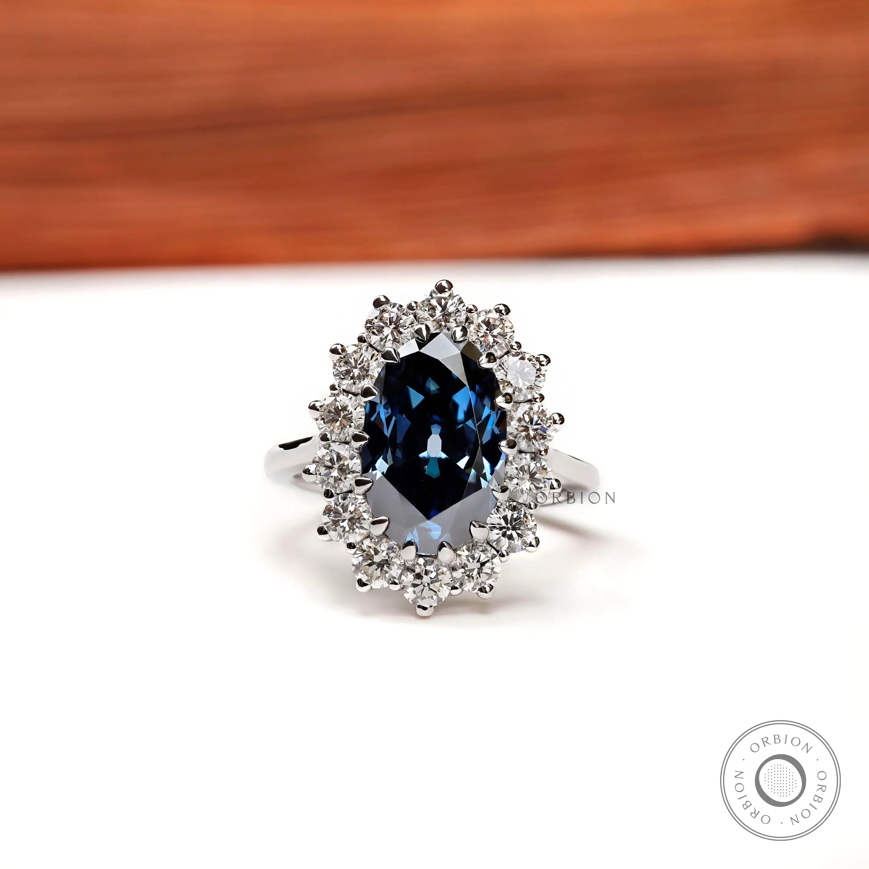 Oval deep blue moissanite halo engagement ring 18k white gold