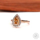 Side profile of pear champagne moissanite halo engagement ring