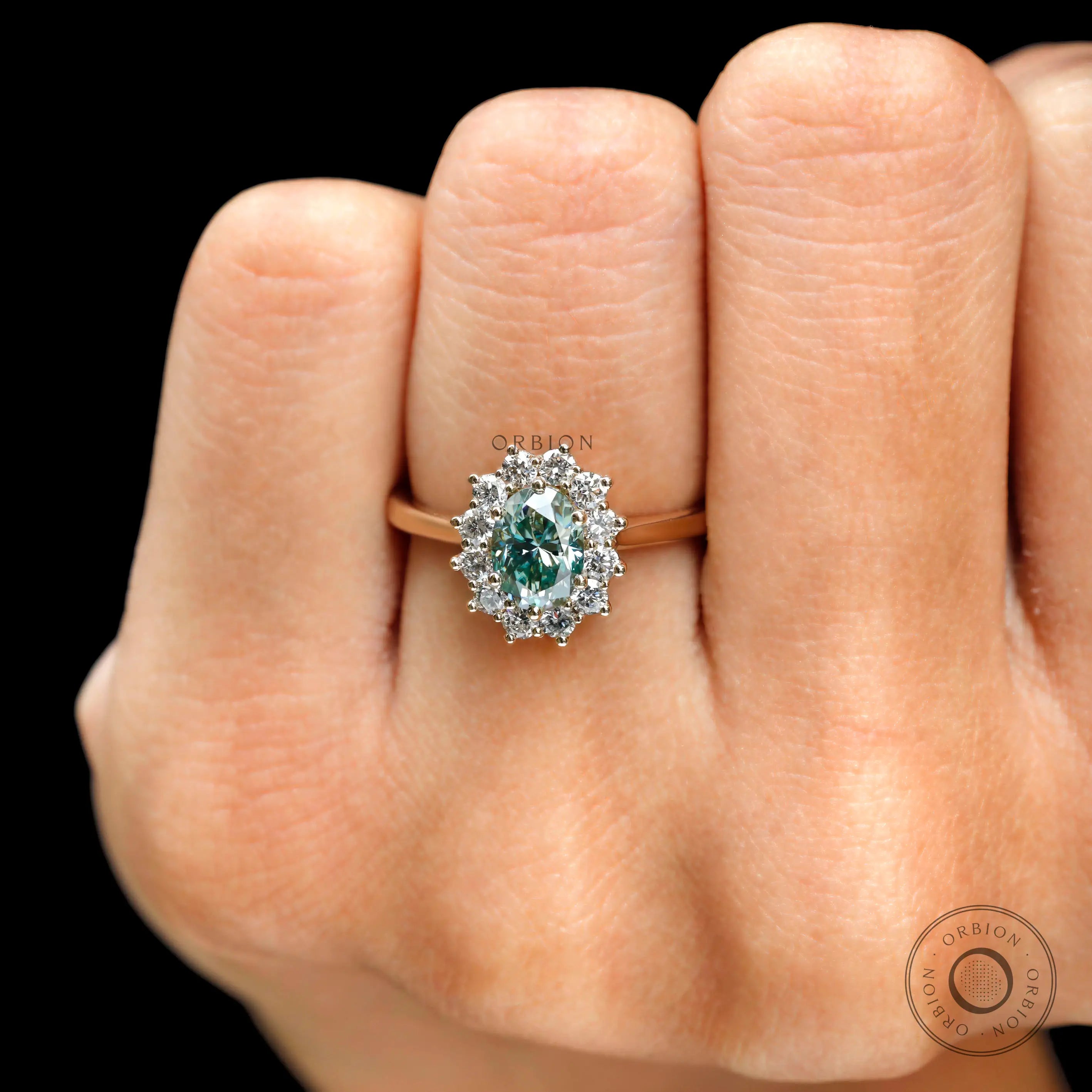Oval blue green moissanite ring prong setting detail