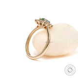 Oval halo ring minimalist yellow gold cathedral shank
