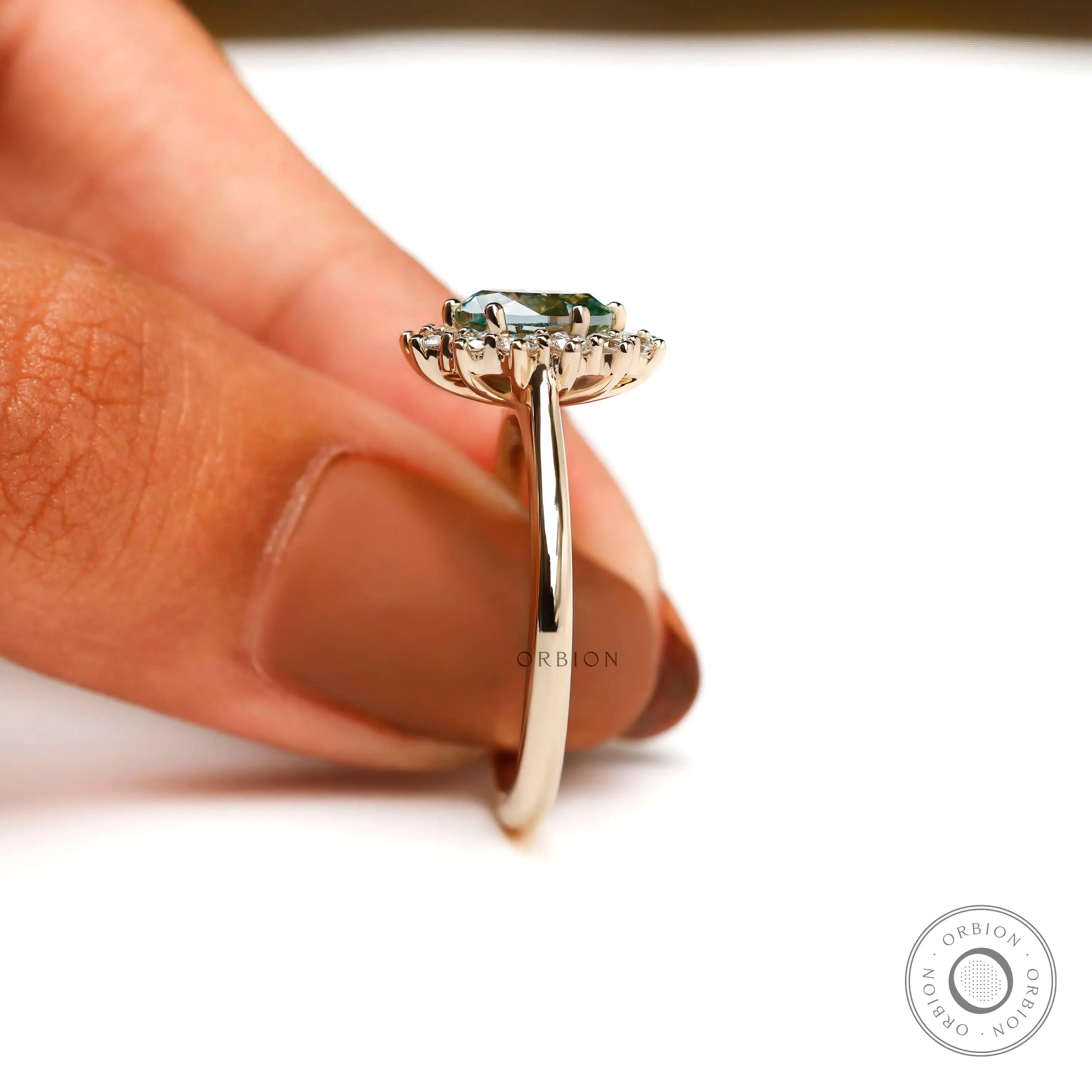 Halo engagement ring with oval center stone polished band