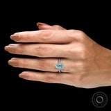 Pear cut light green moissanite halo ring on fingure